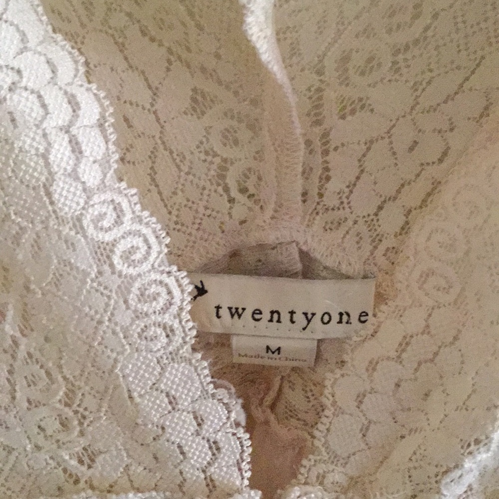 Cream colored off the shoulder blouse.